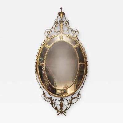 19th Century Irish Gilt Oval Mirror with an Urn and Rams Heads