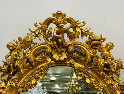 19th Century Palatial Giltwood Wall or Console Mirror Adorning Three Cherubs