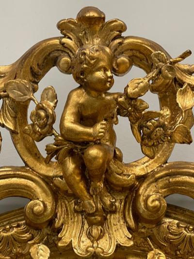 19th Century Palatial Giltwood Wall or Console Mirror Adorning Three Cherubs