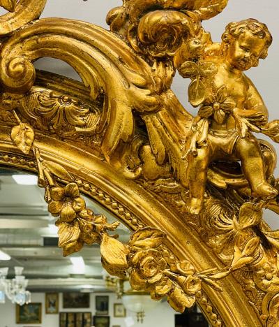 19th Century Palatial Giltwood Wall or Console Mirror Adorning Three Cherubs