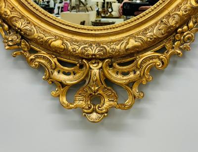 19th Century Palatial Giltwood Wall or Console Mirror Adorning Three Cherubs