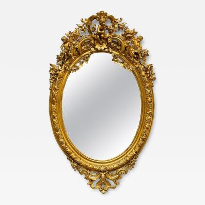 19th Century Palatial Giltwood Wall or Console Mirror Adorning Three Cherubs