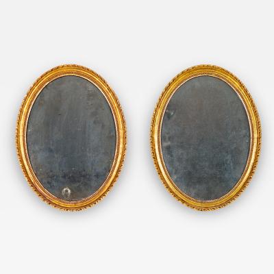 2697 Pair of 18th Century English Oval Gilt Mirrors