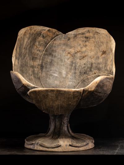 4 chairs hand carved out of one solid block in the form of a stylized flower