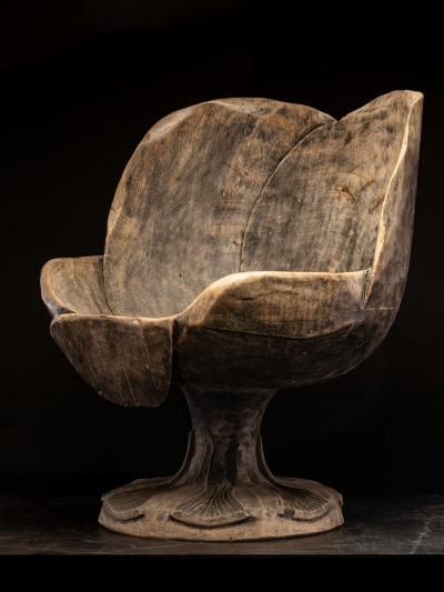 4 chairs hand carved out of one solid block in the form of a stylized flower