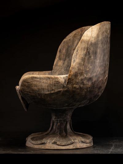 4 chairs hand carved out of one solid block in the form of a stylized flower