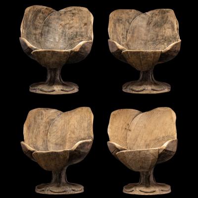 4 chairs hand carved out of one solid block in the form of a stylized flower