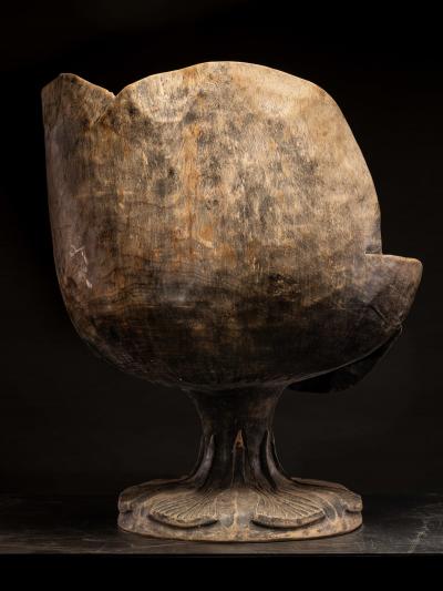 4 chairs hand carved out of one solid block in the form of a stylized flower