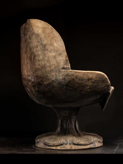 4 chairs hand carved out of one solid block in the form of a stylized flower