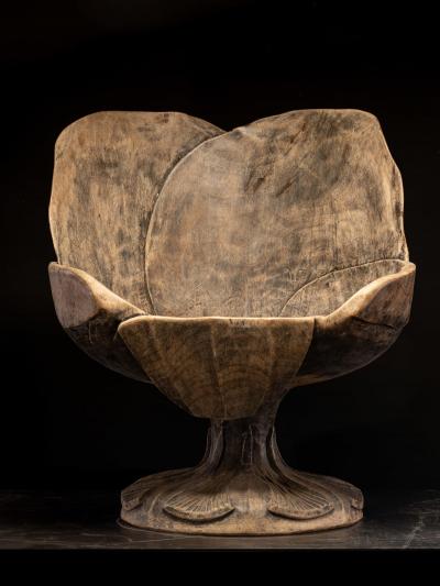 4 chairs hand carved out of one solid block in the form of a stylized flower