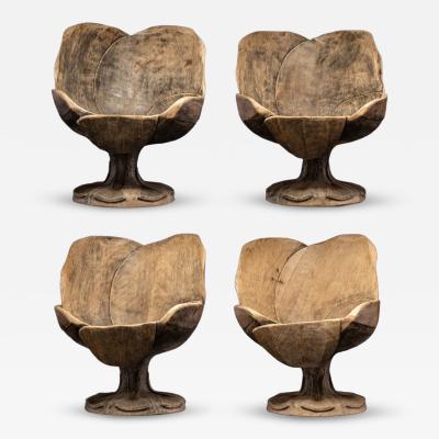 4 chairs hand carved out of one solid block in the form of a stylized flower