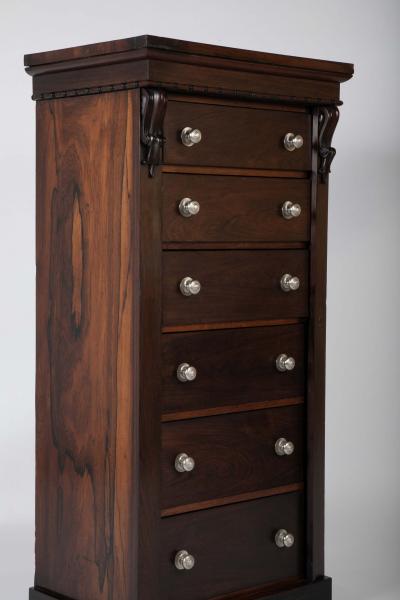 A 19th Century Brazilian Rosewood Six Drawer Wellington High Cabinet