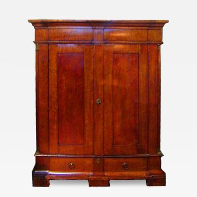 A 19th Century French Empire Plum Mahogany Armoire accented with Ormolu mounts