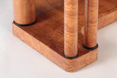 A 19th century figured elm console resting on four round Doric style columns