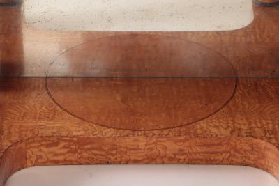 A 19th century figured elm console resting on four round Doric style columns