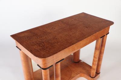 A 19th century figured elm console resting on four round Doric style columns