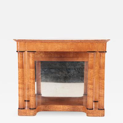 A 19th century figured elm console resting on four round Doric style columns