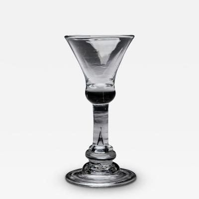 A BALUSTER WINE WITH FLARED BOWL ABOVE A STRAIGHT SECTION