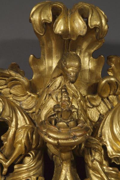 A BAROQUE ACANTHUS GILTWOOD MIRROR CARVED WITH UNUSUAL SERPENT