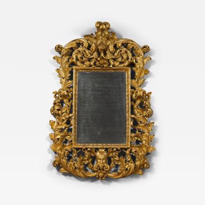 A BAROQUE ACANTHUS GILTWOOD MIRROR CARVED WITH UNUSUAL SERPENT