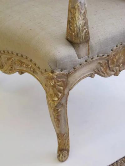 A Baronial French Regence Style Ivory Painted Open Armchair