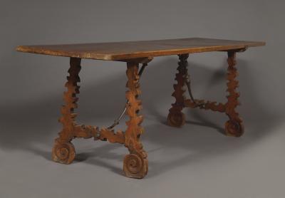 A Baroque Period Trestle Ended And Forged Iron Table