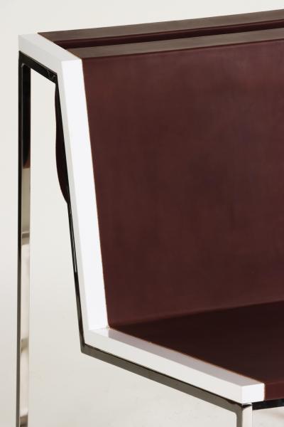 A Bauhaus minimal inspired leather and stainless steel chair contemporary