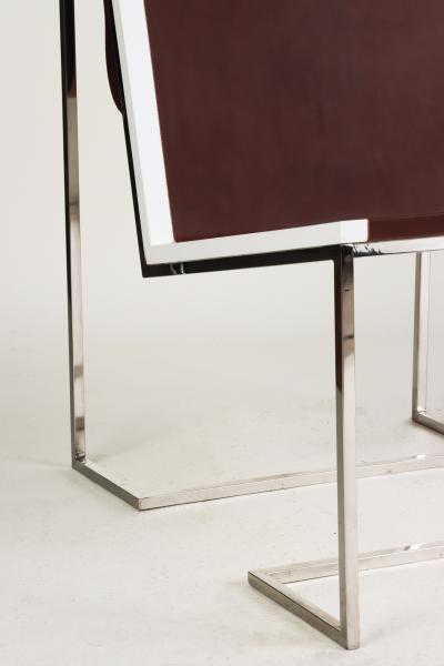 A Bauhaus minimal inspired leather and stainless steel chair contemporary