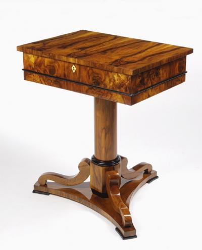A Biedermeier work table with a lift top