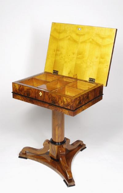 A Biedermeier work table with a lift top