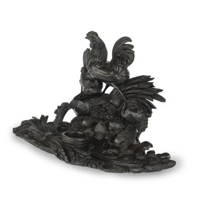 A Black Forest carved wood inkwell with wheat sheafs and poultry