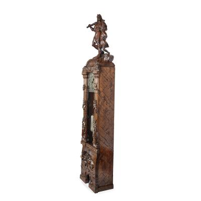 A Black Forest linden wood long case clock by Spring of Interlaken