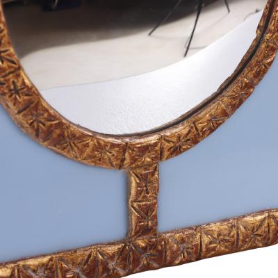A Blue Glass and Resin Quadrant Wall Mirror 