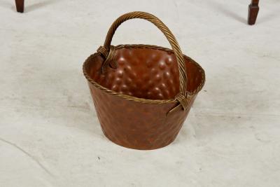 A Brass Loop Handled Dimpled Basket
