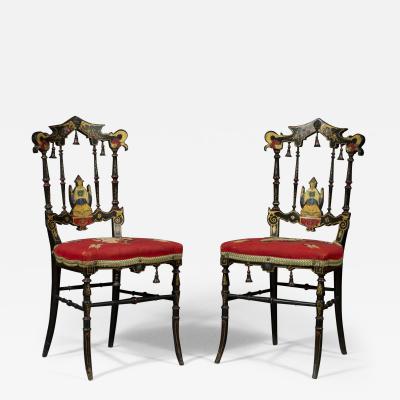 A CHARMING PAIR OF BLACK LACQUER AND POLYCHROME PAINTED CHINOISERIE SIDE CHAIRS