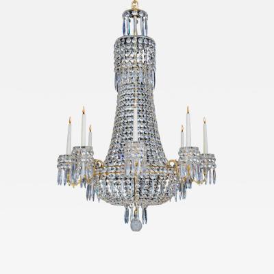 A CLASSIC REGENCY EIGHT LIGHT CUT GLASS CHANDELIER