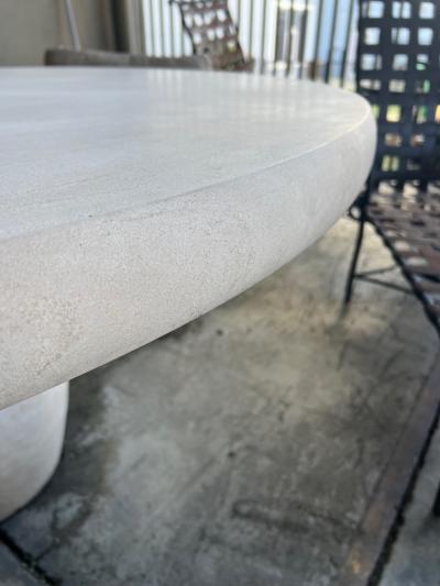 A Carved French Limestone Round Dining Center Table with Barrel form Base