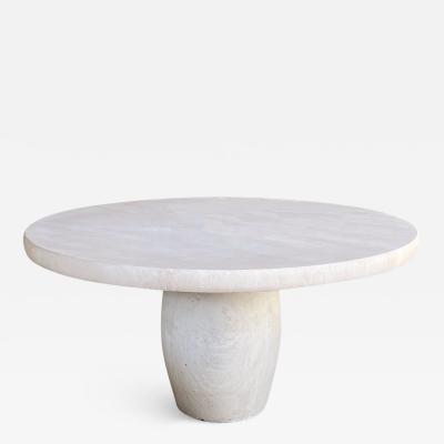 A Carved French Limestone Round Dining Center Table with Barrel form Base