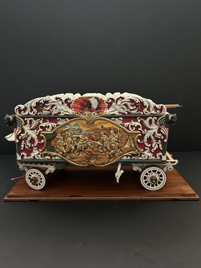 A Carved and Polychrome Paint Decorated Model of a Circus Wagon 