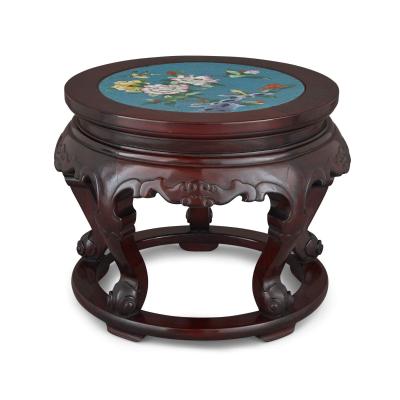 A Chinese cloisonn enamel inset circular carved hardwood pedestal