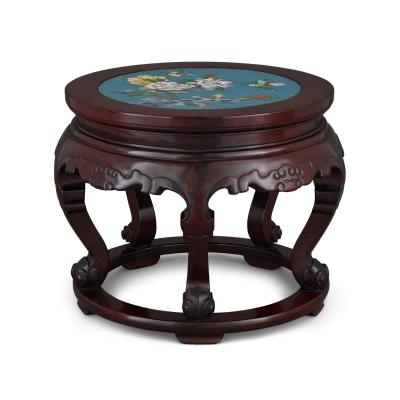 A Chinese cloisonn enamel inset circular carved hardwood pedestal