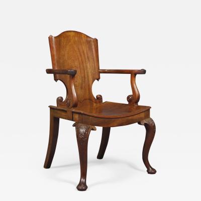 A Cuban Mahogany Armchair The Back In The Form Of A Paper Scroll