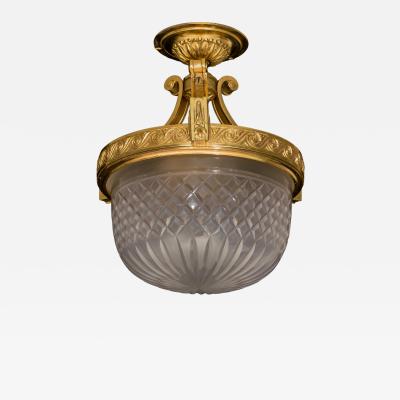 A EDWARDIAN ORMOLU MOUNTED CEILING LIGHT
