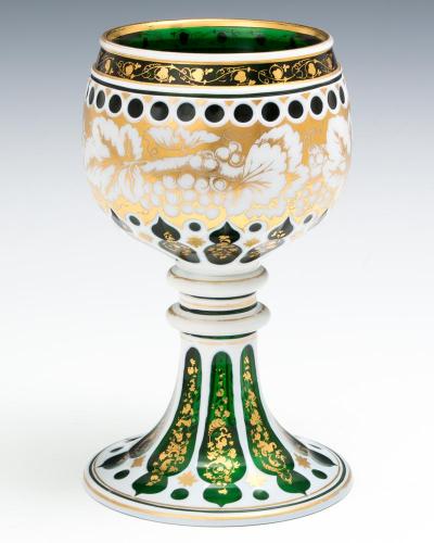 A EMERALD GREEN WHITE OVERLAID GOBLET WITH GILT DECORATION