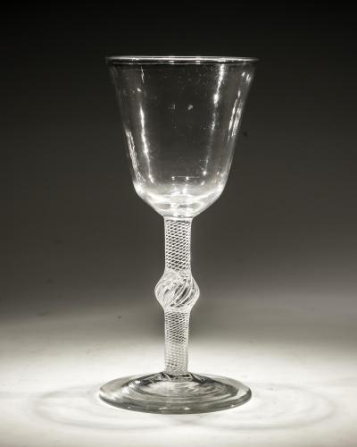 A FINE CENTRAL KNOPPED AIR TWIST GOBLET WITH ROUND FUNNEL BOWL