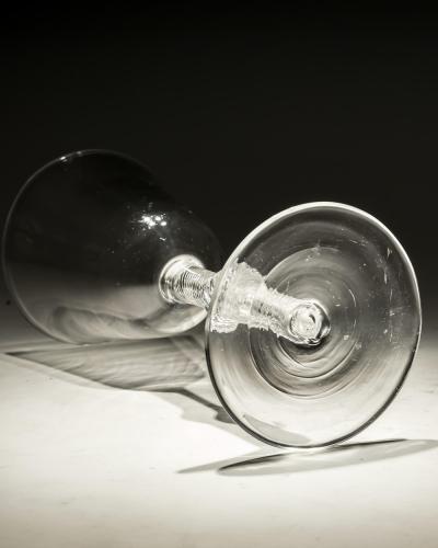 A FINE CENTRAL KNOPPED AIR TWIST GOBLET WITH ROUND FUNNEL BOWL