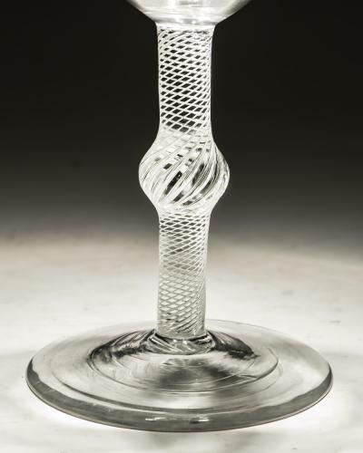 A FINE CENTRAL KNOPPED AIR TWIST GOBLET WITH ROUND FUNNEL BOWL