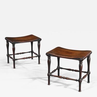 A FINE PAIR OF GEORGE III PERIOD MAHOGANY HALL STOOLS