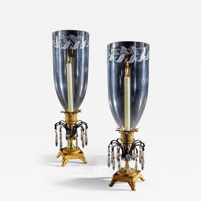 A FINE PAIR OF ORMOLU AND BRONZE REGENCY STORM LIGHTS