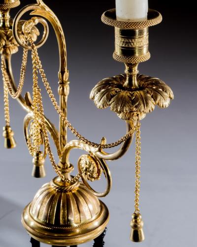 A FINE PAIR OF ORMOLU AND BRONZE TEMPLE CANDELABRA